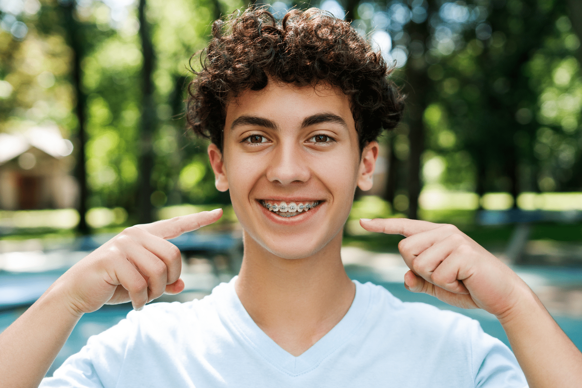 Teen smiling with braces during summer in Metuchen, NJ